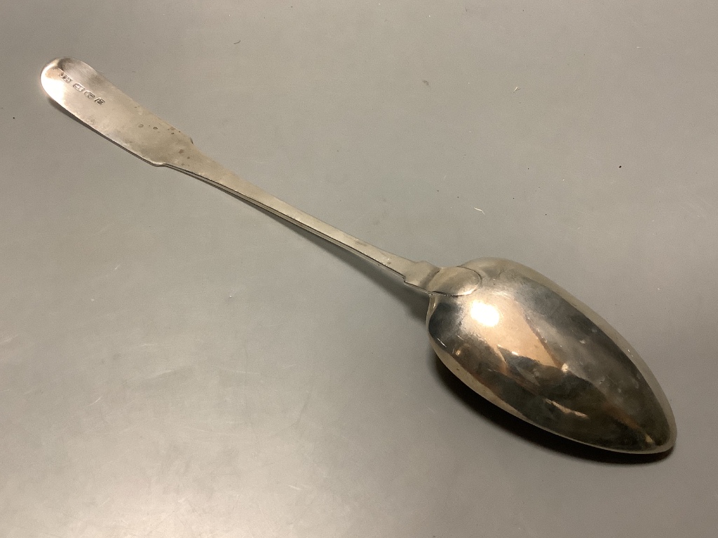 A George III Irish silver fiddle pattern straining spoon by John Power, Dublin, 1804, length 34 cm, 4.5 oz.